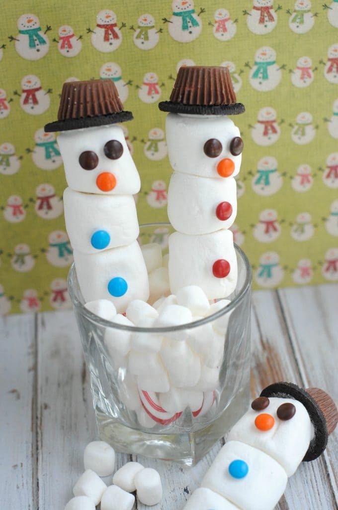 Candy Cane Snowmen made with marshmallows, candy canes, Reese's cups and sandwich cookies