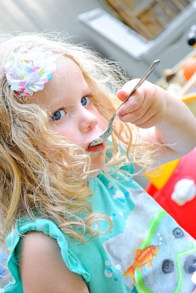 Enjoying Yoplait as a snack while enjoying summer